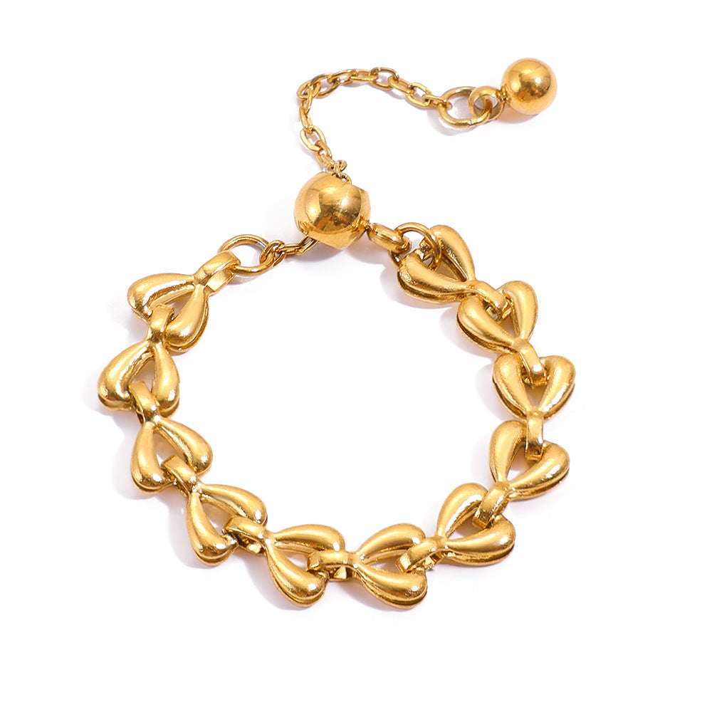 Penelope Gold Tone Hollow Heart Chain Ring