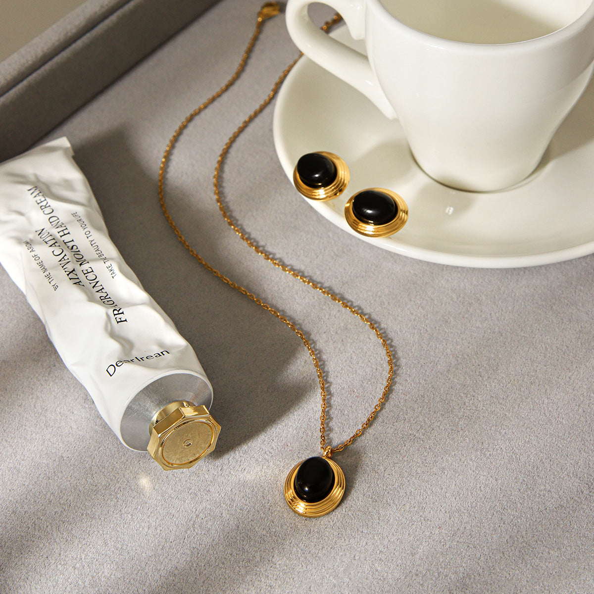 Lillian Gold Tone Black Stone Earrings