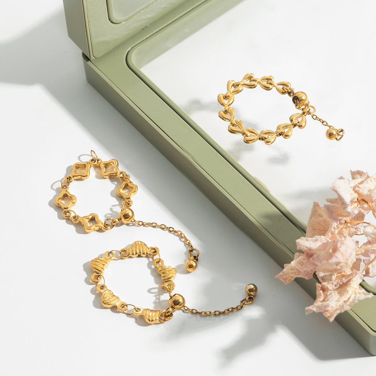 Penelope Gold Tone Hollow Heart Chain Ring